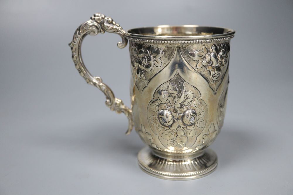 A Victorian embossed silver christening mug, George Adams, London, 1875, 10.7cm, 142 grams.